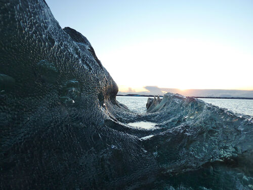 The glacier ice is often filled with suspended particles of volcanic ash.
