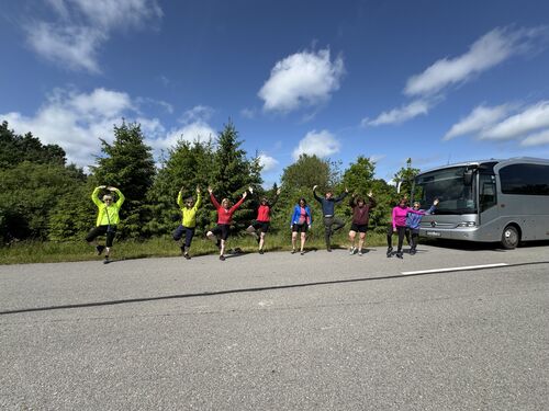 Got people to stretch along the drive.  Bus is electric