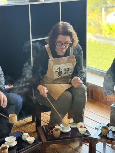 Amy ladling the hot water into the brew cup