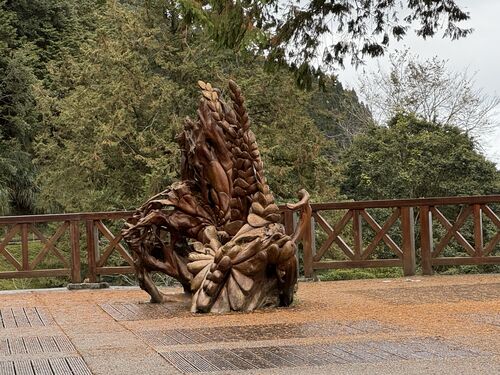 Wood sculpture in front of the Alishan Train Station