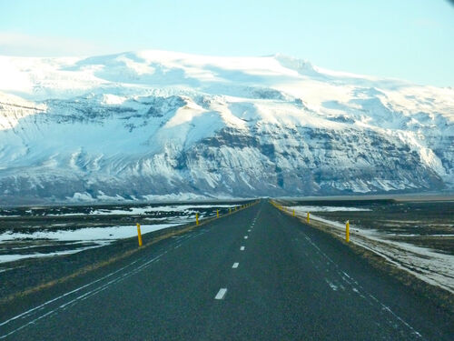 Snow-covered mountains in the distance.