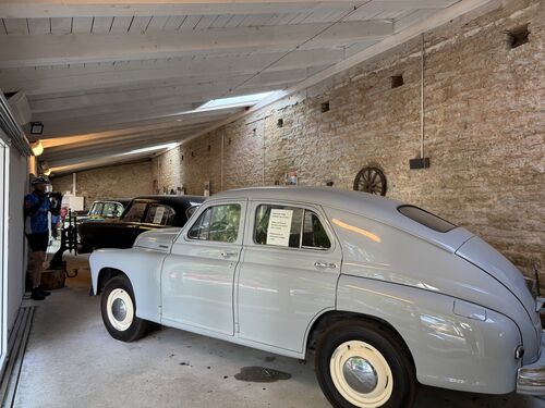 Old garage with Soviet era knock-offs of American Cars
