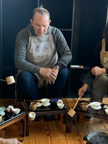 Bill wearing the apron that says: Old Tea