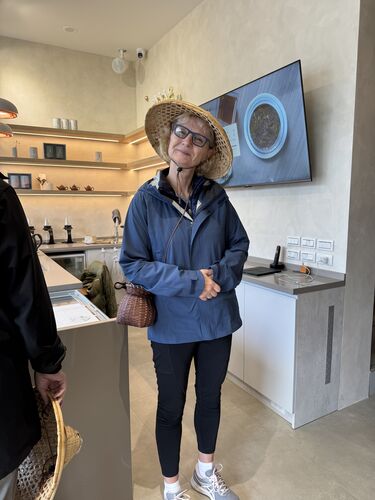 Deborah looking very chic in her tea picking garb