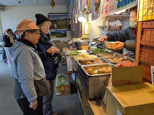 Kathi and I get lunch.  Note the bamboo plate at the far end of the counter, that is the edible memory I mentioned